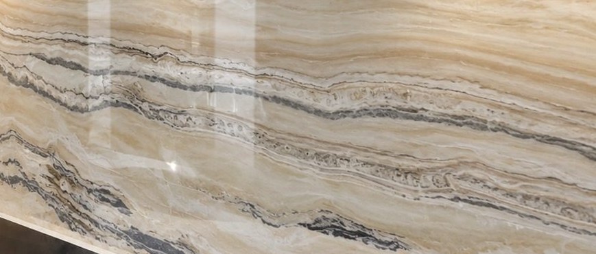 Close-up of a glossy printed marble-effect glass splashback