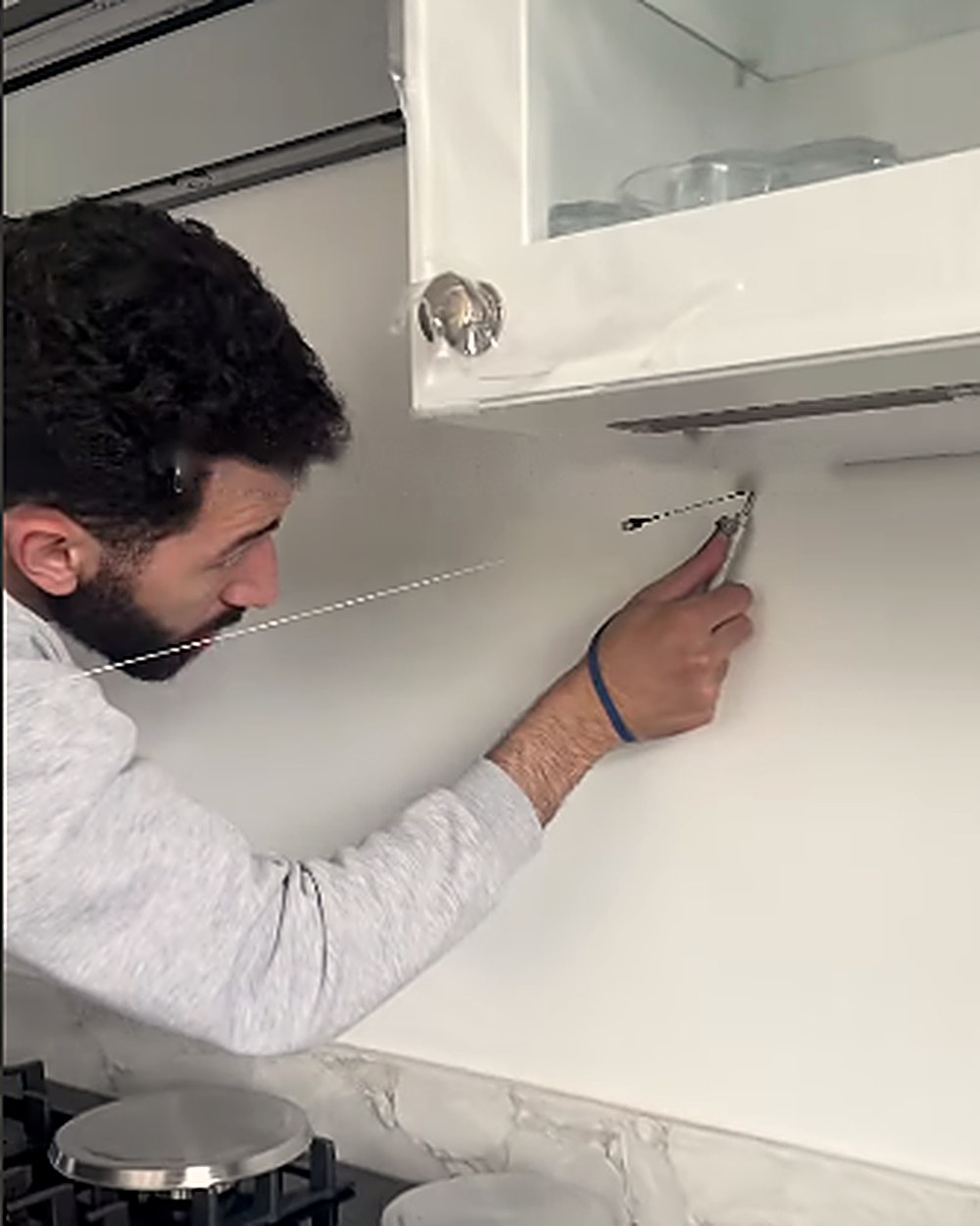 Our surveyor measuring a kitchen wall with a Prodim Proliner digital template